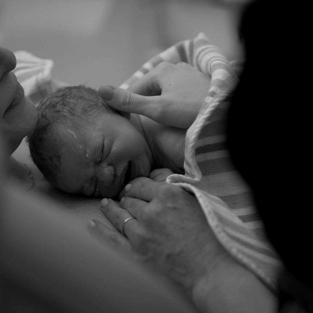 Newborn baby resting, moments after delivery